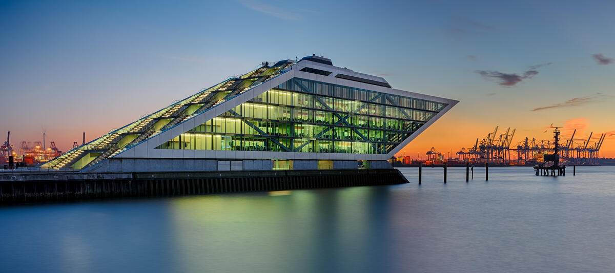 Hamburg’s Dockland beside the water at dusk.