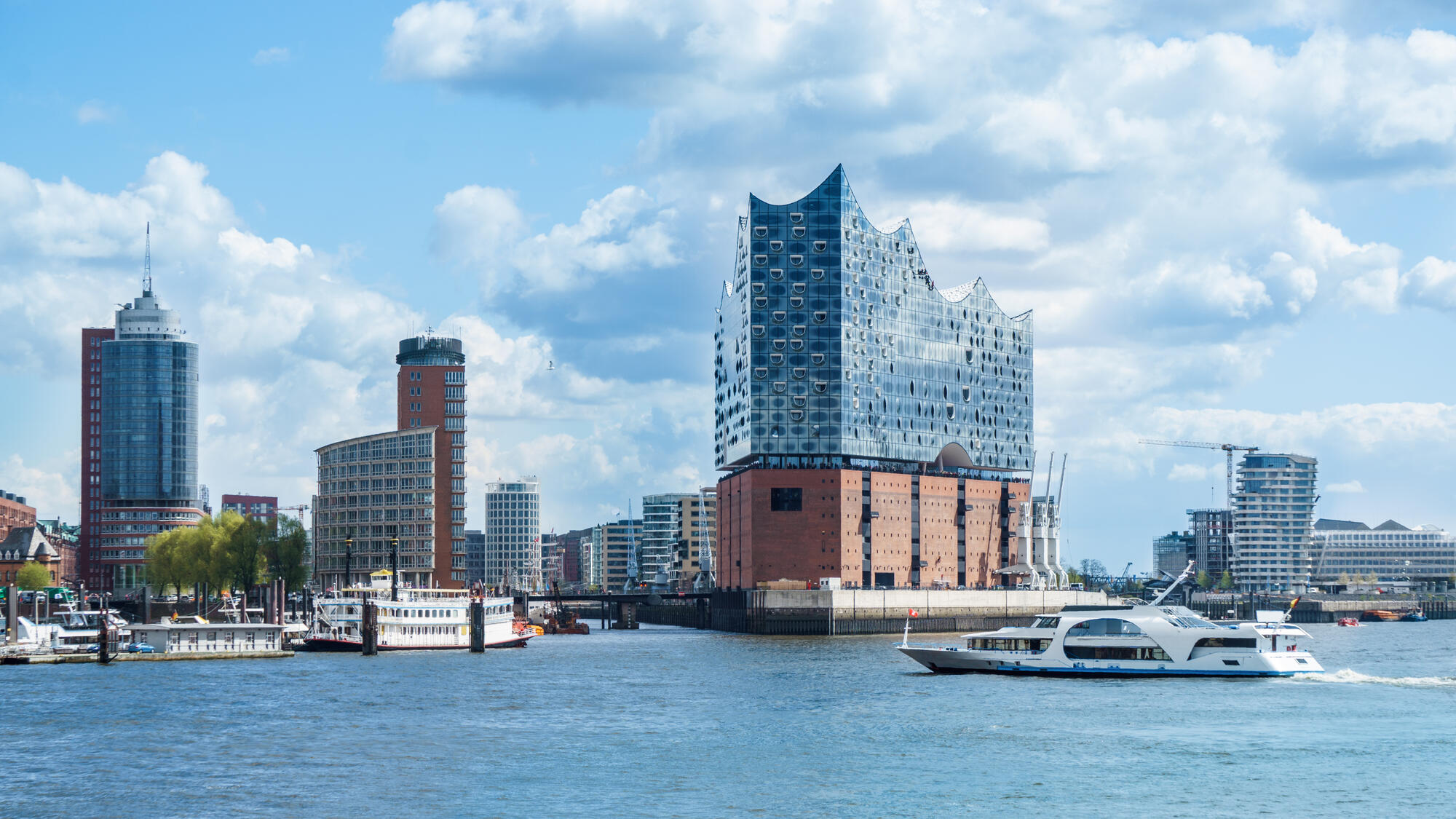 The Elbphilharmonie and boats on the Elbe.