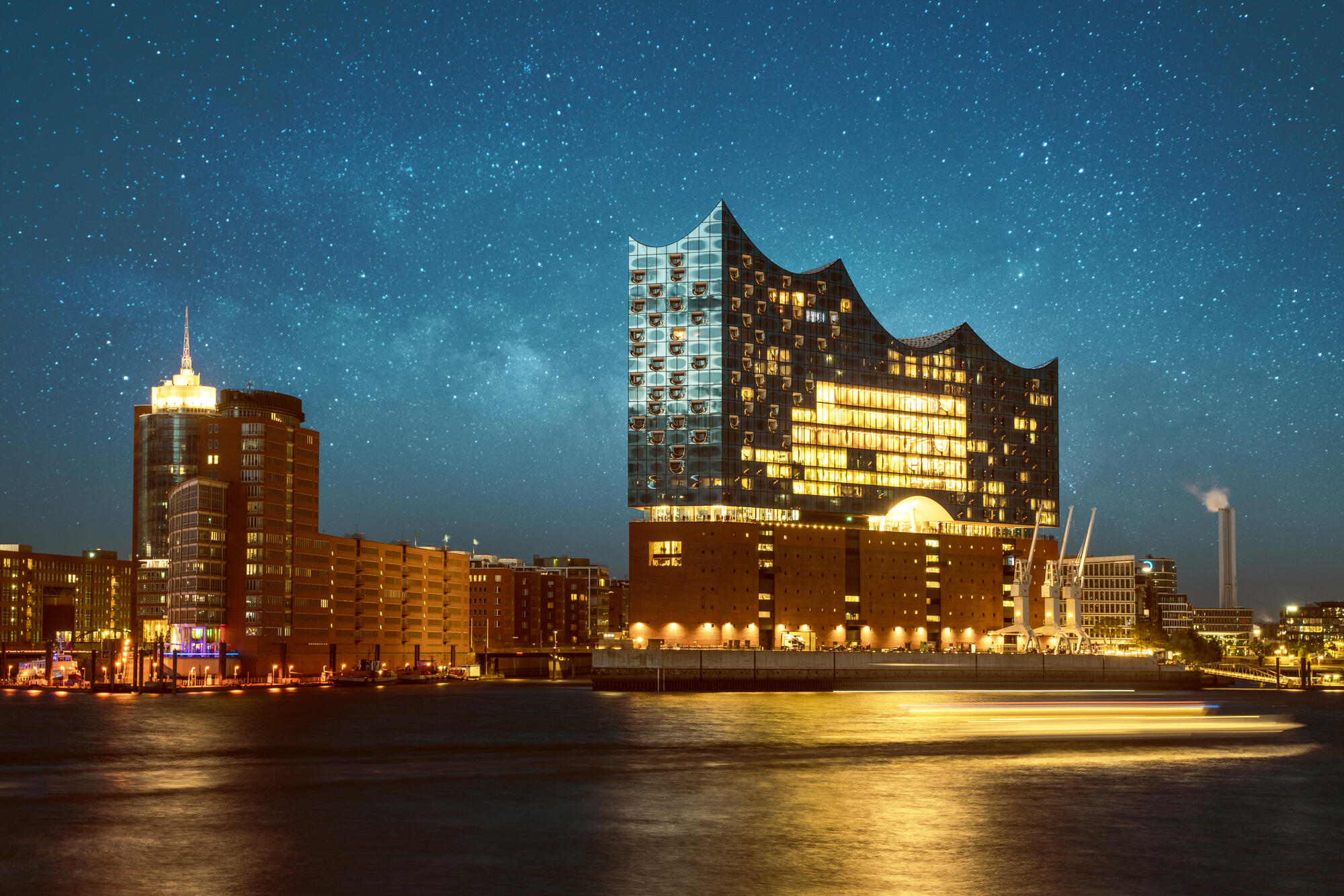 The Elbphilharmonie beneath a starry sky.