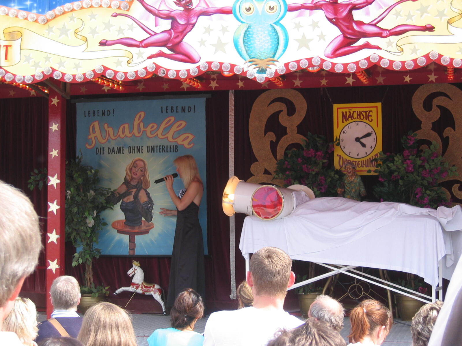 Sideshow booth ‘Arabella, the Lady Without a Lower Body’ with spectators