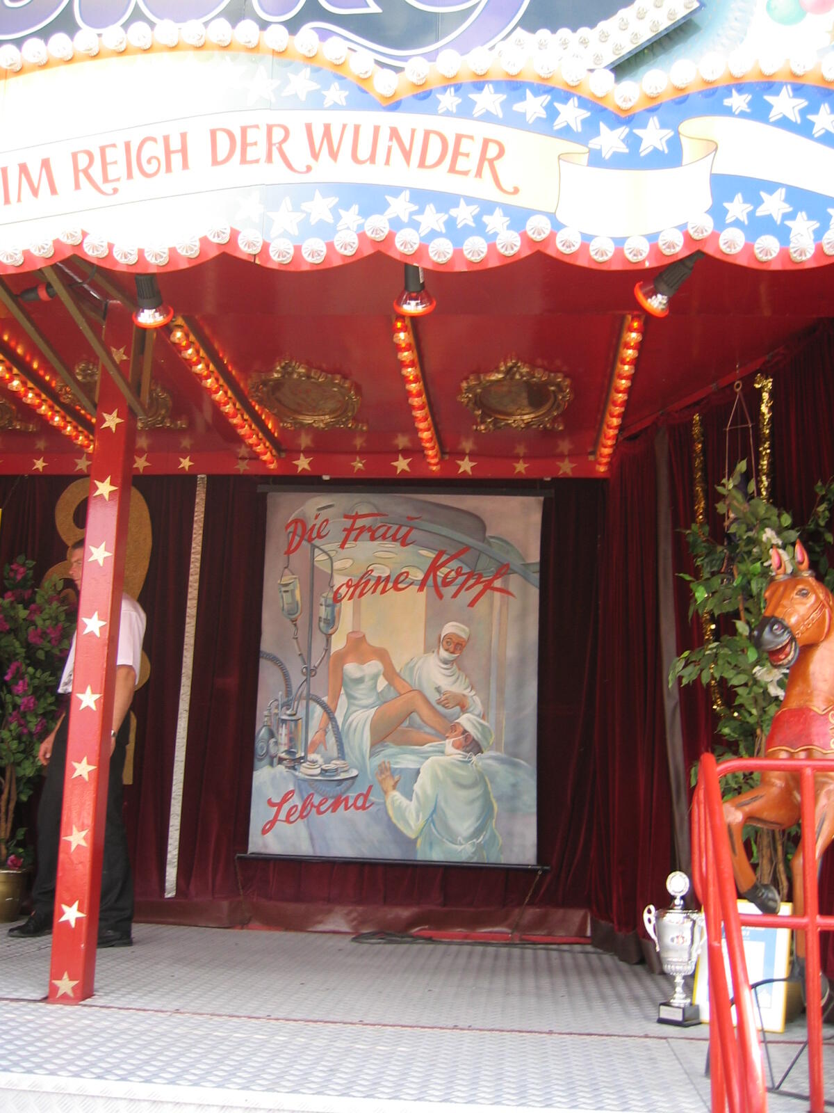 Fairground booth with the poster ‘The Headless Woman’