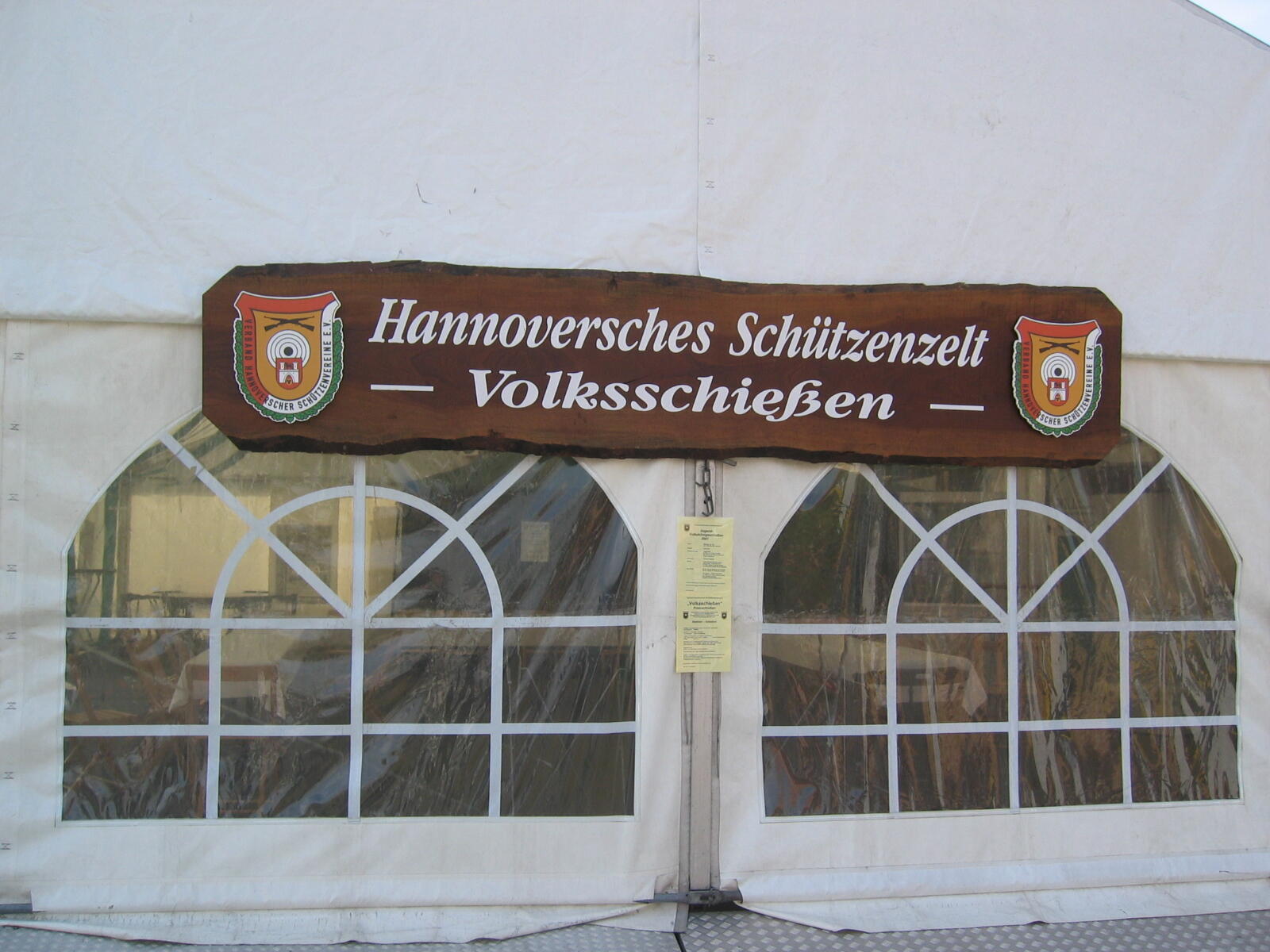 Sign reading “Hanoverian Marksmen’s Tent – Public Shooting” on a festival marquee