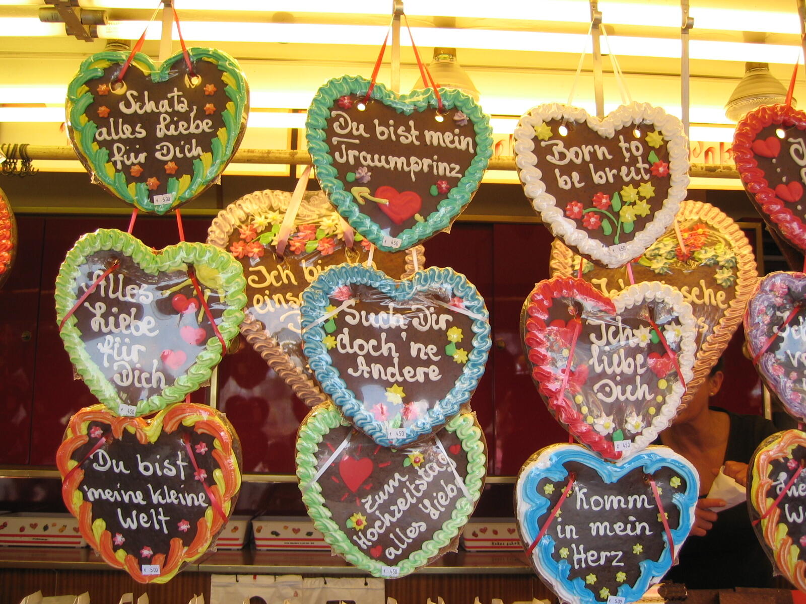 Colourful gingerbread hearts with messages at a stall