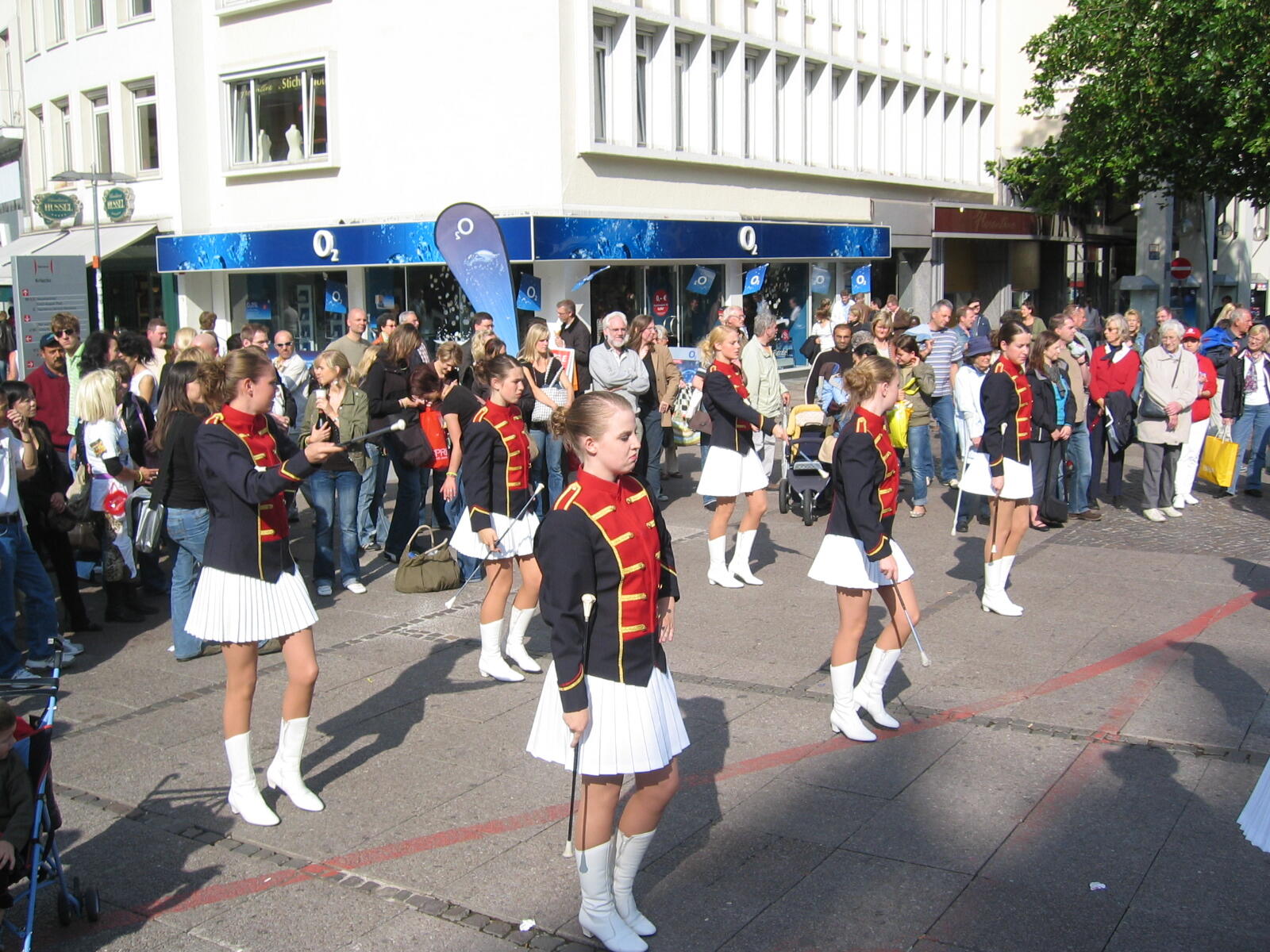 Girls’ troupe in white skirts and boots at the parade