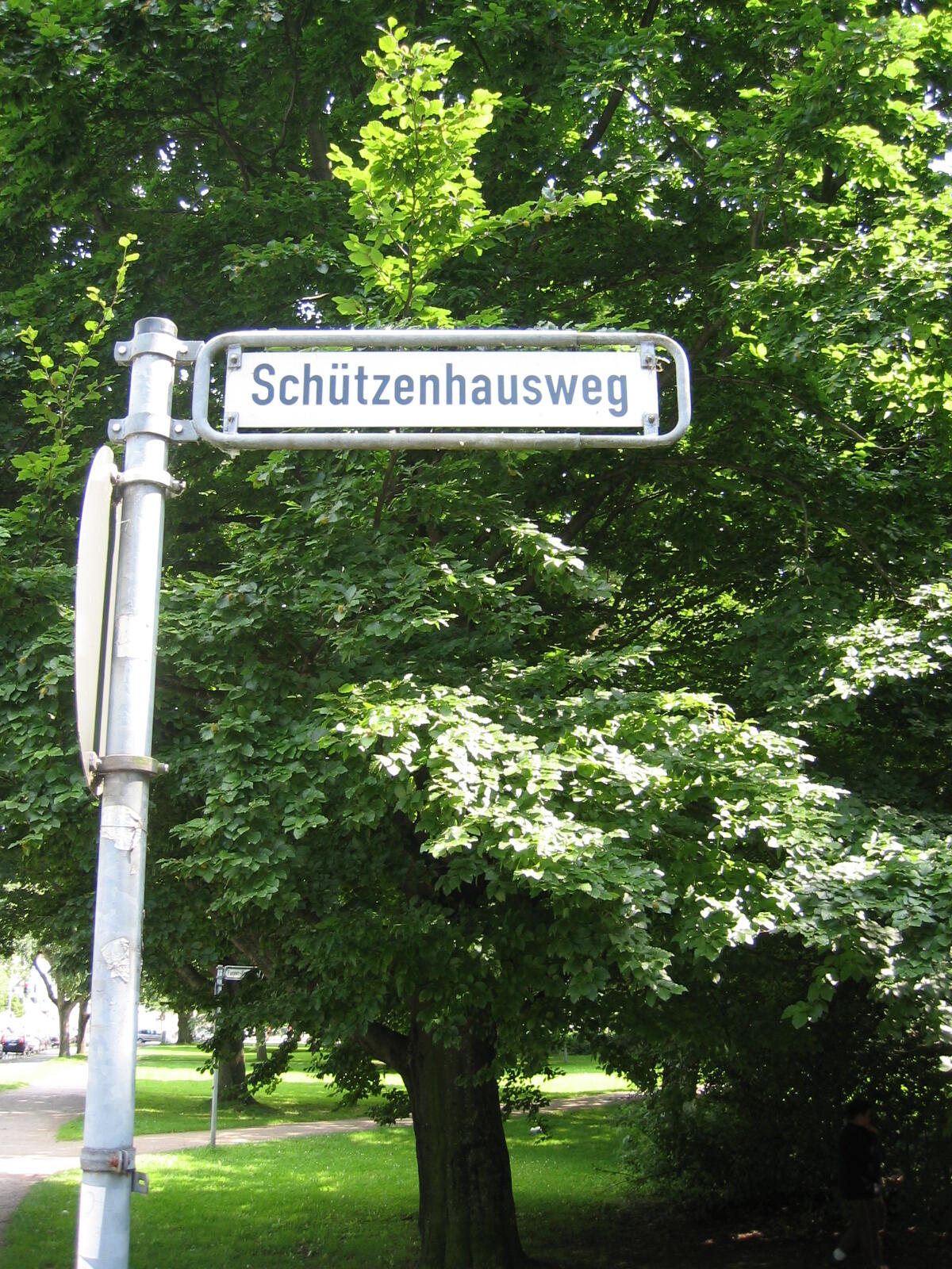 Schützenhausweg street sign between trees
