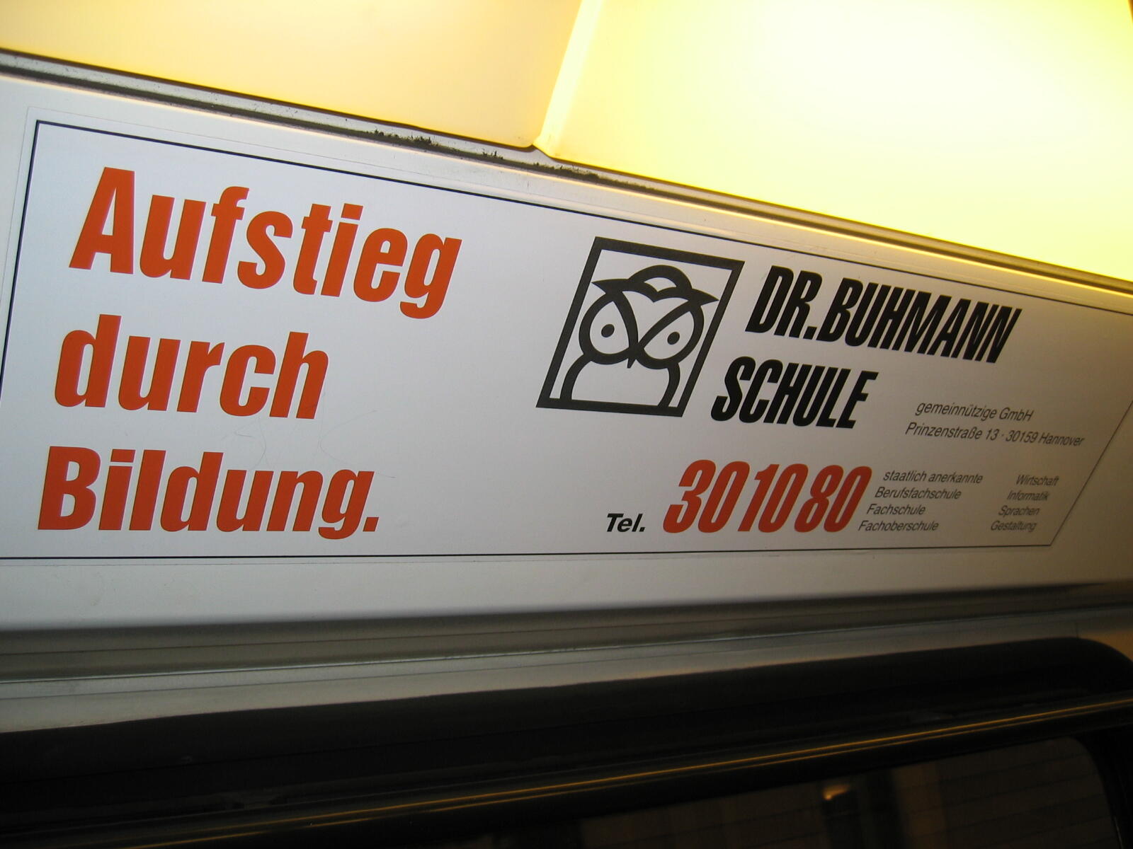 “Advancement through Education” advert for Dr. Buhmann Schule with owl logo