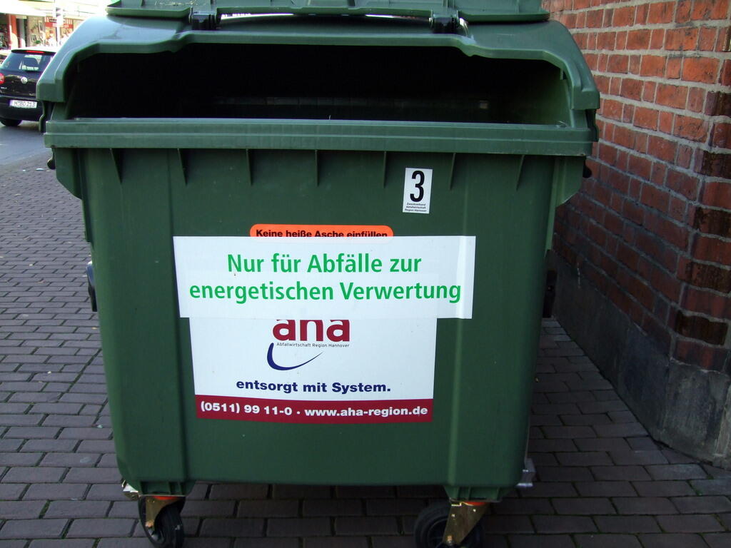 Green bin with sticker: For waste for energy recovery only