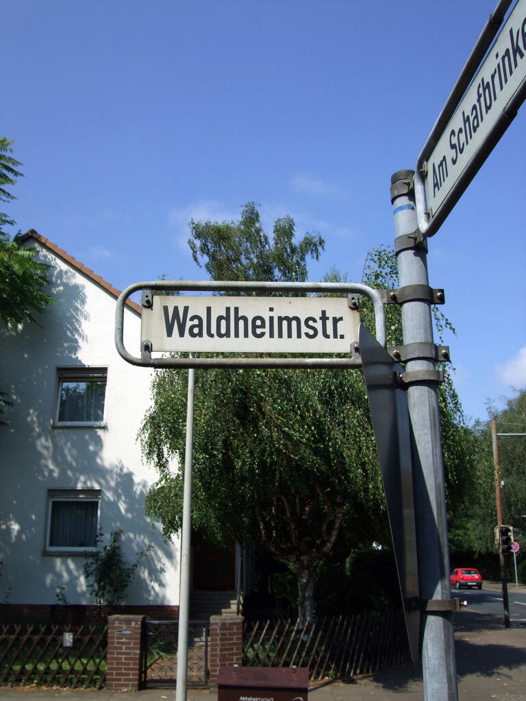 Waldheimstraße street sign in front of a white house