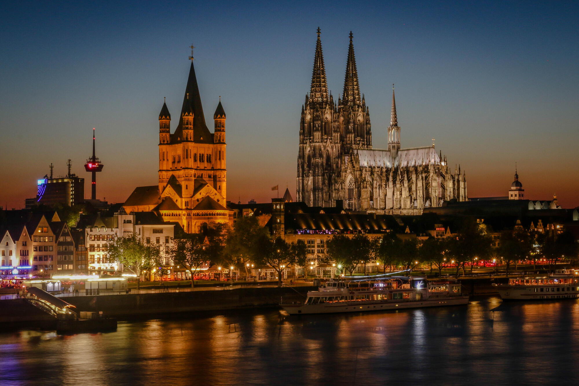 Cologne’s illuminated old town beside the Rhine.