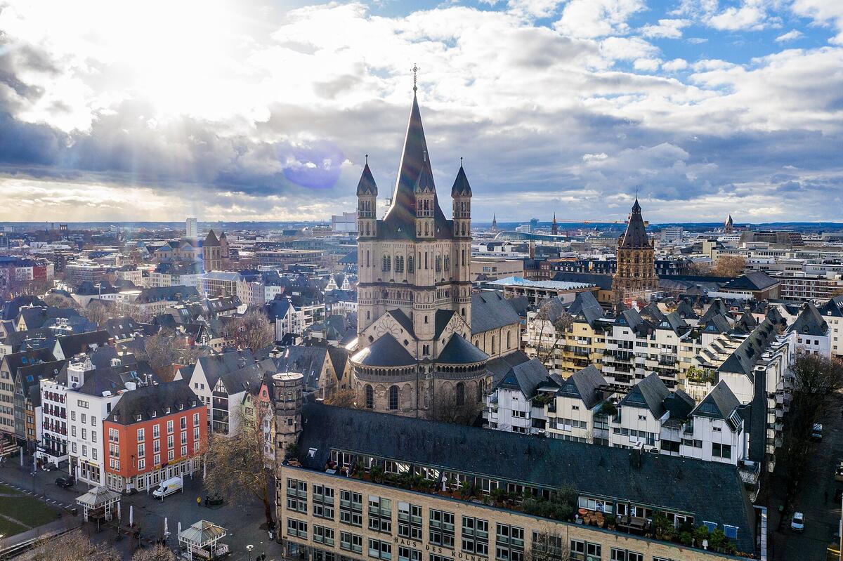 A view of Great St. Martin, Fischmarkt and the Rhine gardens in Cologne.