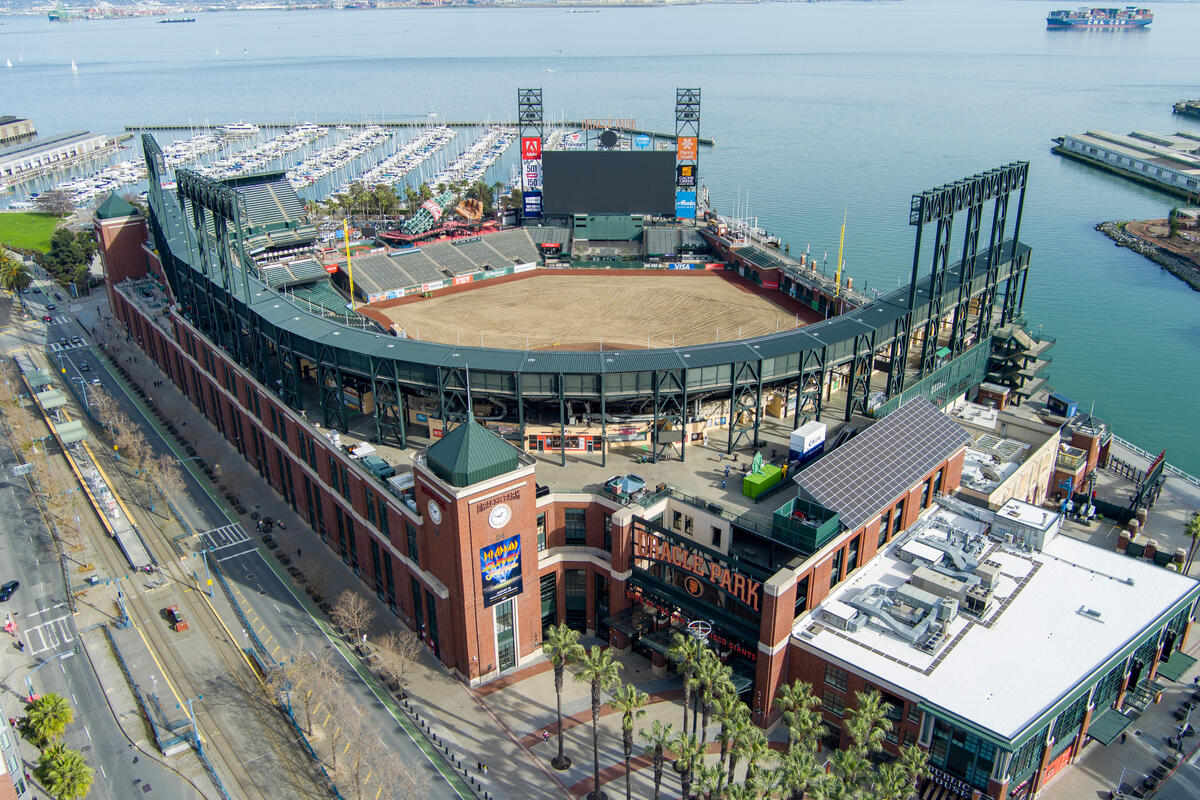 The baseball stadium's field, stands and large scoreboard sit directly beside the harbour basin.
