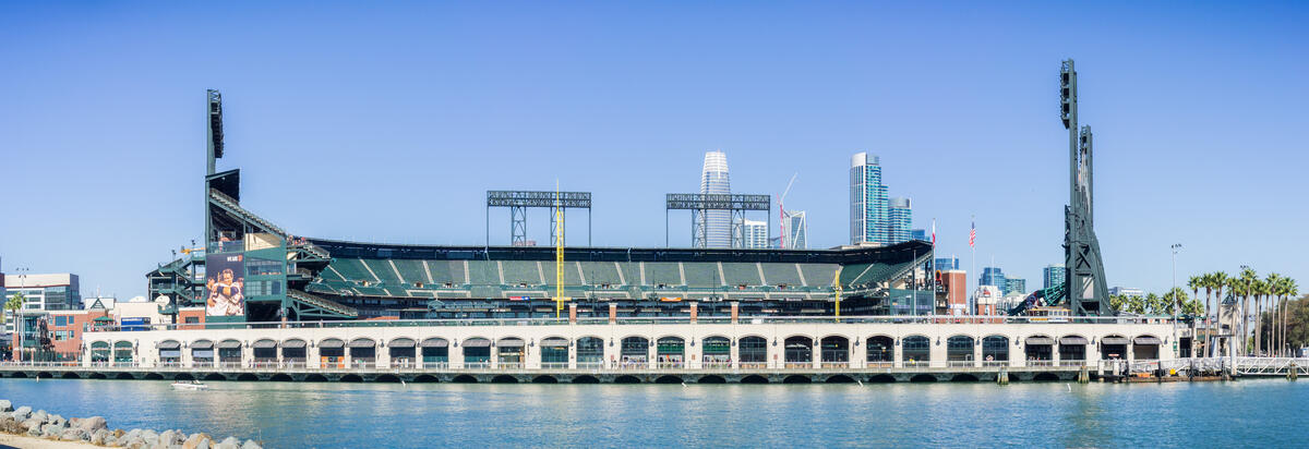 This 2017 image shows today's Oracle Park, with arcades, stands and floodlight towers beside the water.