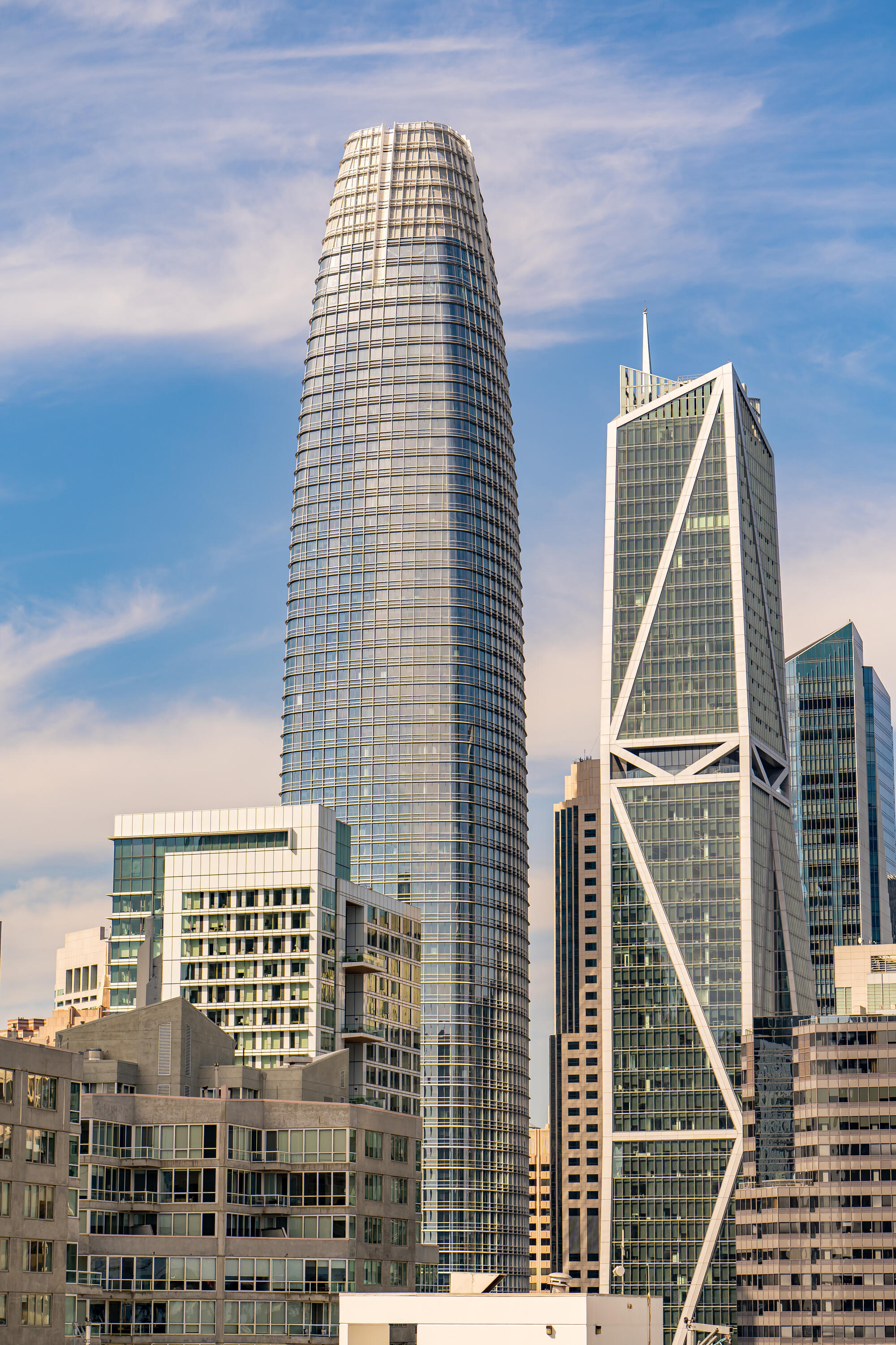 The tapering Salesforce Tower stands beside the distinctive diagonal braces of 181 Fremont.