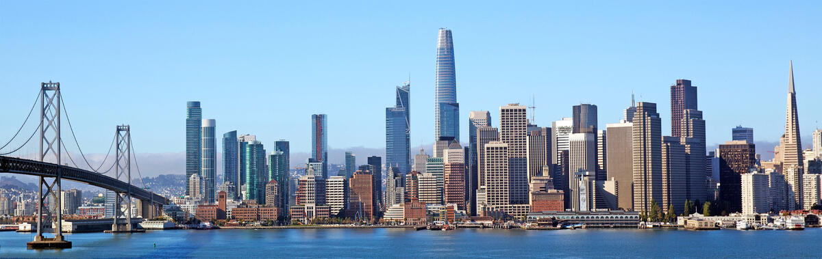A view across the water towards San Francisco's high-rises, with part of the Bay Bridge on the left.