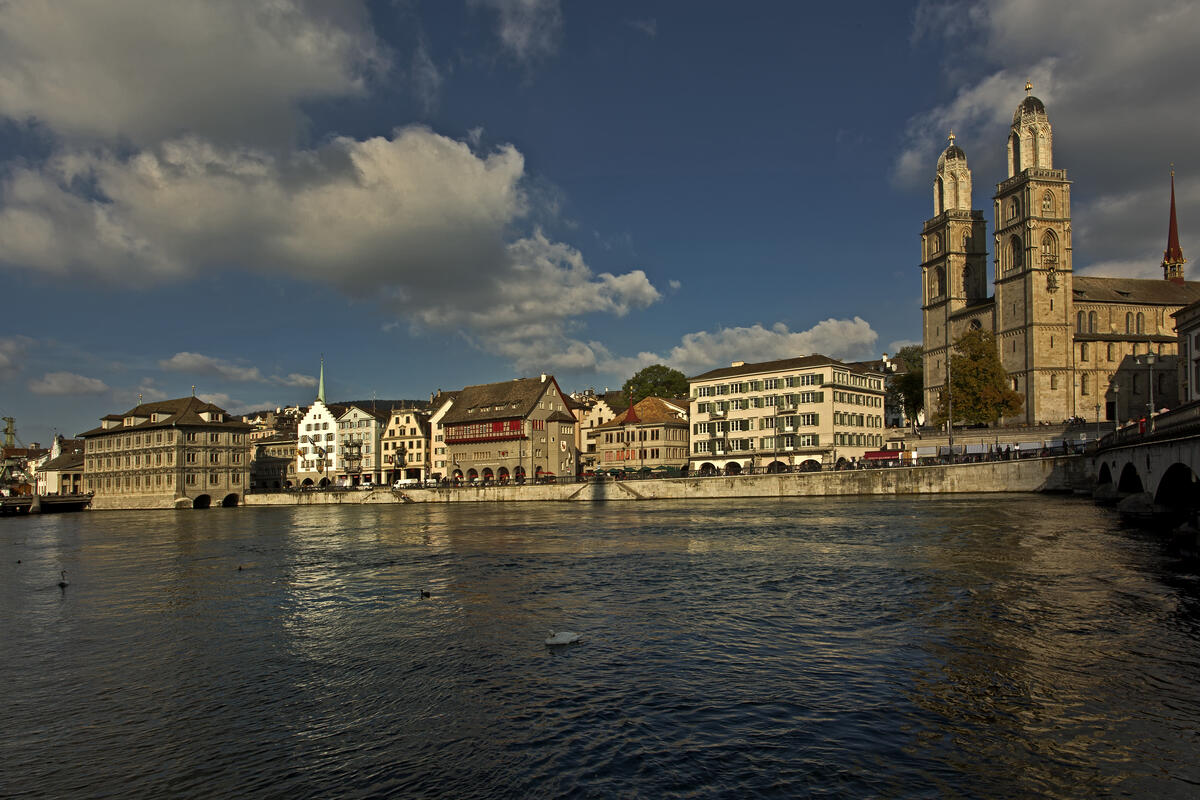 Grossmünster and the buildings along Limmatquai in Zurich, seen from the opposite bank.